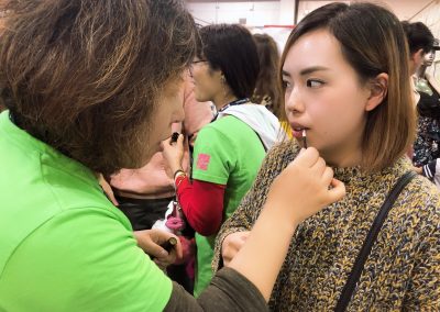 Customers trying the lipstick